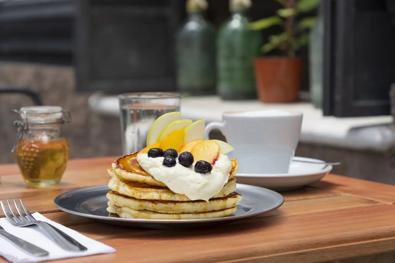 Pancakes and coffee on a cafe table. The photo was not taken at an East Cobb restaurant.