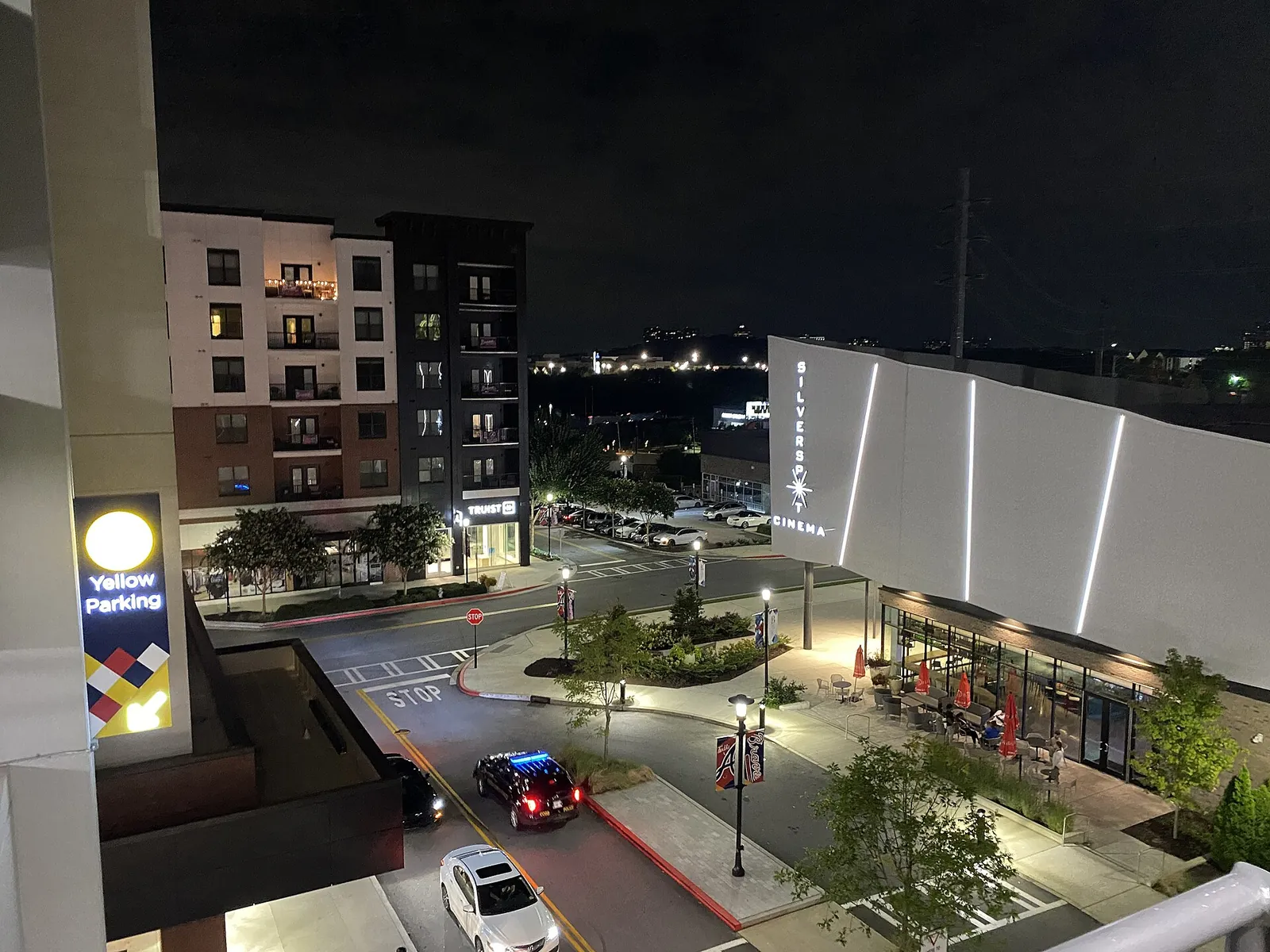 The Battery Atlanta at night, seen from a parking deck near Truist Park