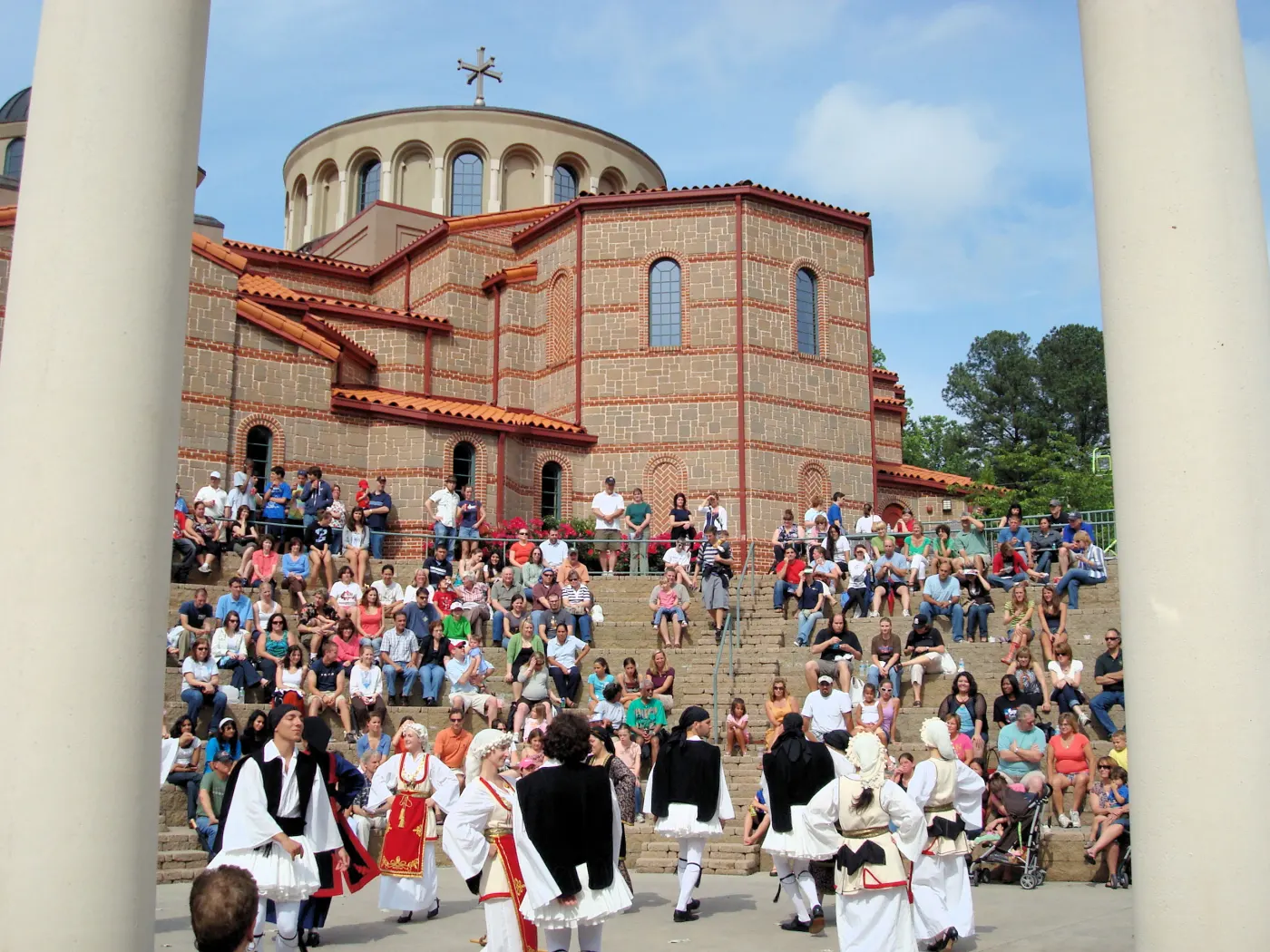 Greek folk dancers perform in the amphitheater at Holy Transfiguration Greek Orthodox Church during the Marietta Greek Festival