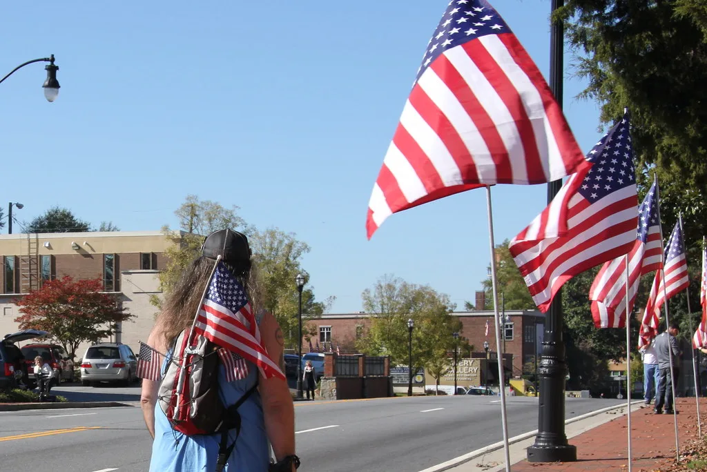 American flags lining the street during Marietta's Veterans Day parade